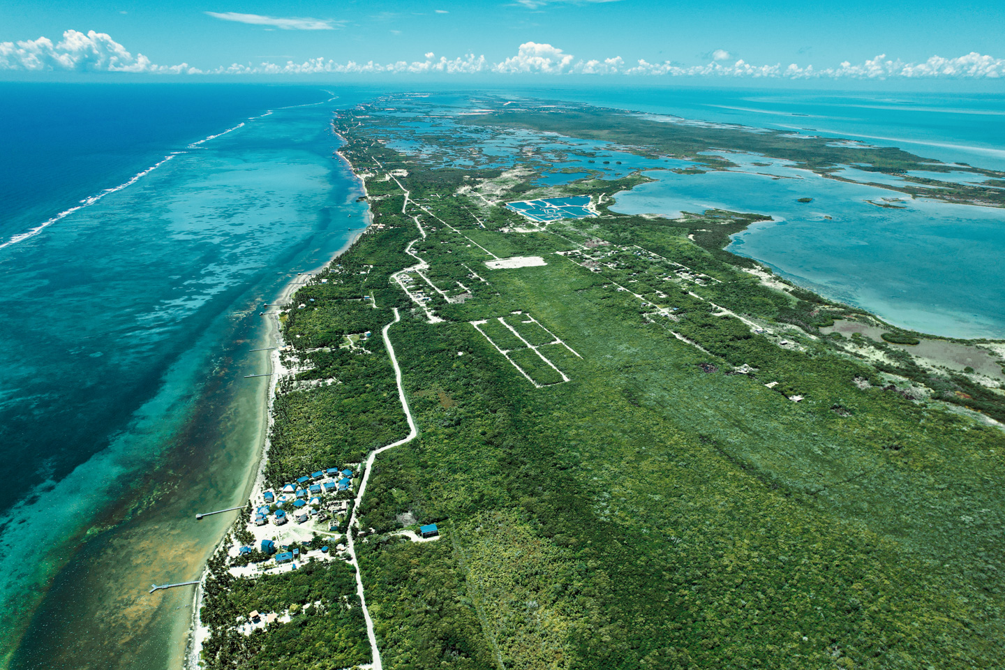 An aerial view featuring the Platinum Point development, extending out the horizon to view Ambergris Caye, Belize. Click to learn more about Platinum Point. An aerial view featuring the Platinum Point development, extending out the horizon to view Ambergris Caye, Belize. Click to learn more about Platinum Point.