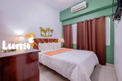 PRICE IMPROVEMENT – Grand Baymen C108 – Corner Garden-Facing 1BR/1BA Condo | Ambergris Caye Real Estate