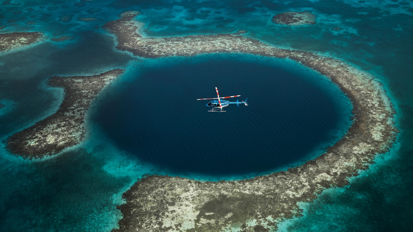 Helicopter tours over Belize’s Great Blue Hole is an excellent option for those who wish to have a bird’s-eye view of the marvel. Helicopter tours over Belize’s Great Blue Hole is an excellent option for those who wish to have a bird’s-eye view of the marvel.