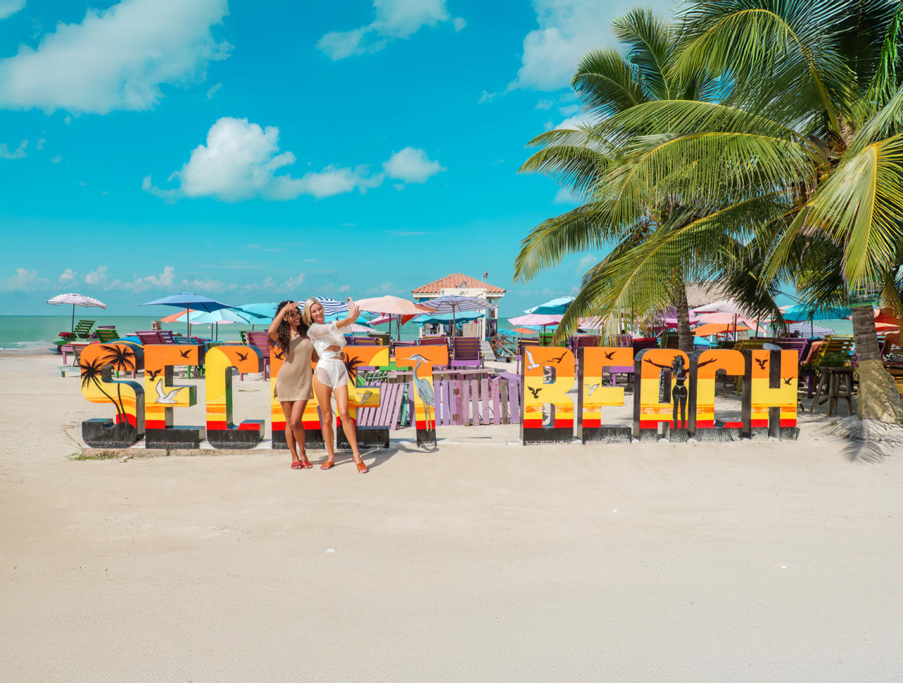 Friends posing in front of the Secret Beach sign, West Ambergris Caye, Belize. Click here to learn more about Secret Beach. Friends posing in front of the Secret Beach sign, West Ambergris Caye, Belize. Click here to learn more about Secret Beach.