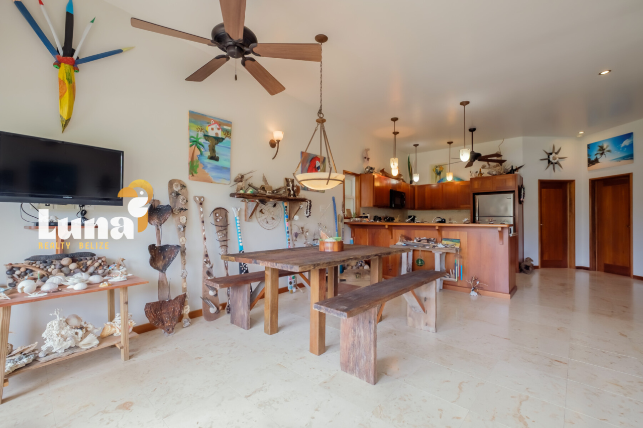 Spacious living room in 2BR condo for sale in Belize